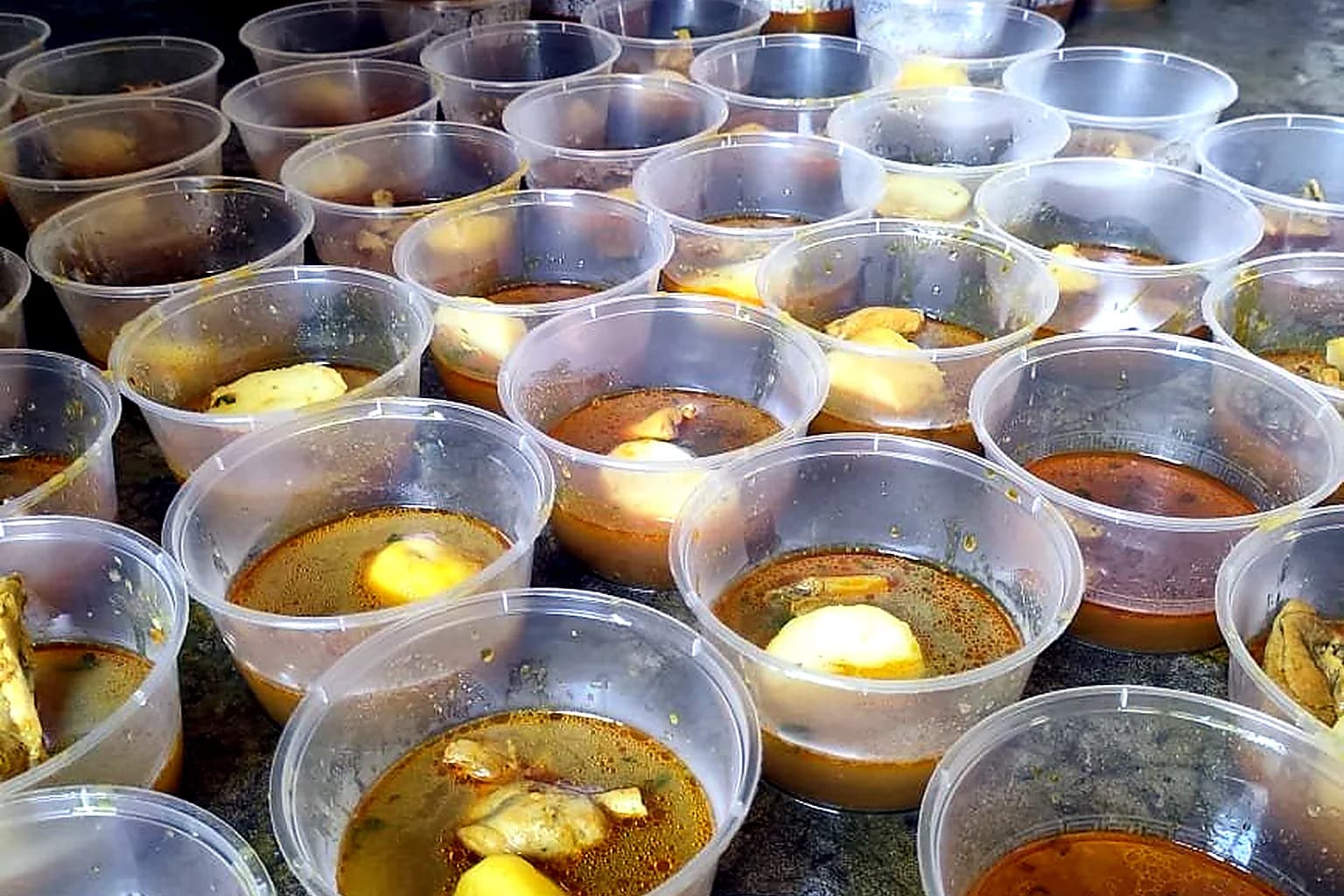 Prepared meal bowls ready for community distribution