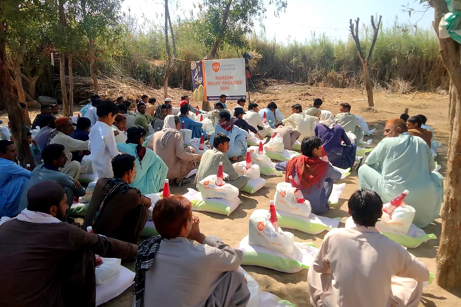 Community members gathered for relief package distribution