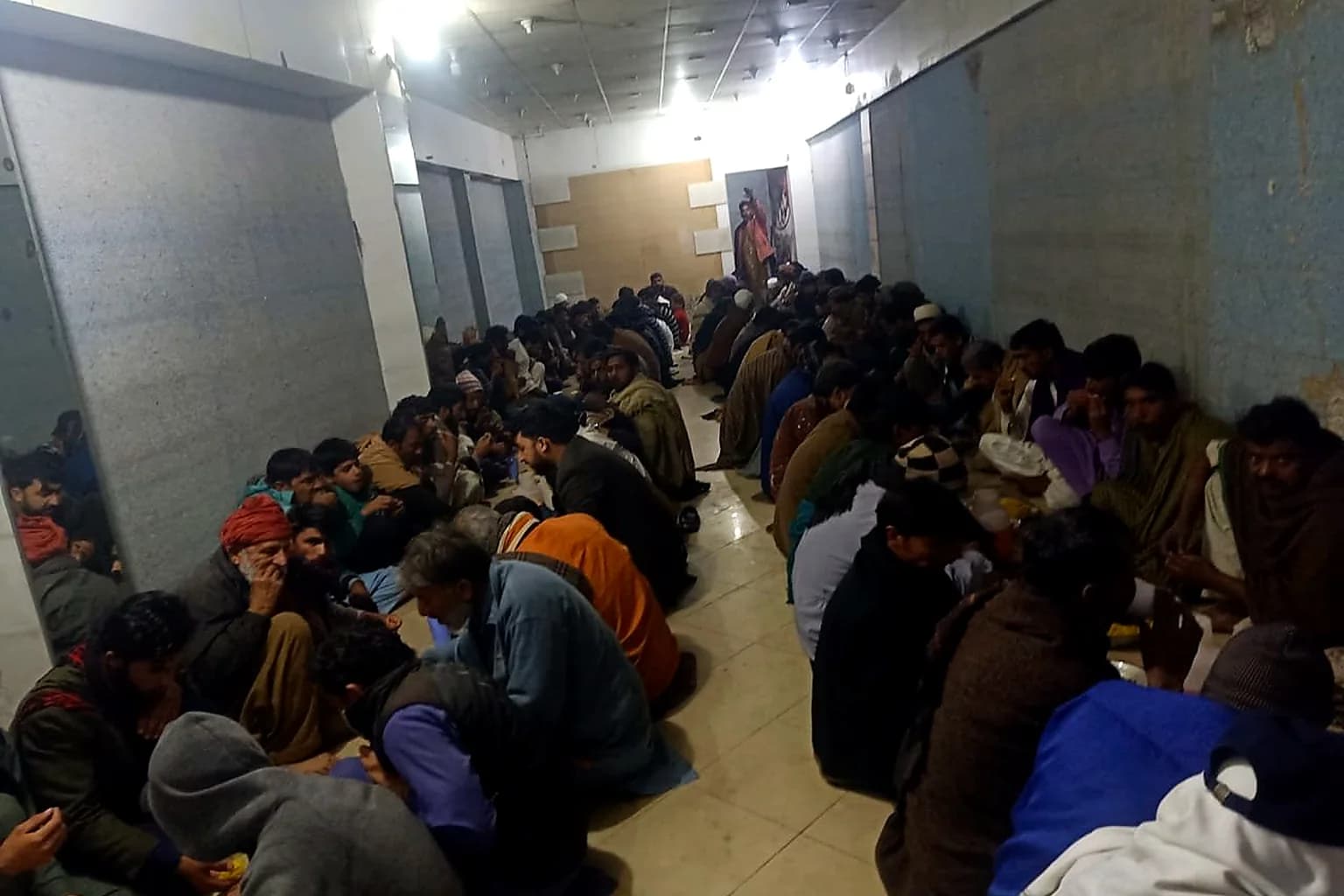 Community members gathered indoors for iftar meal support