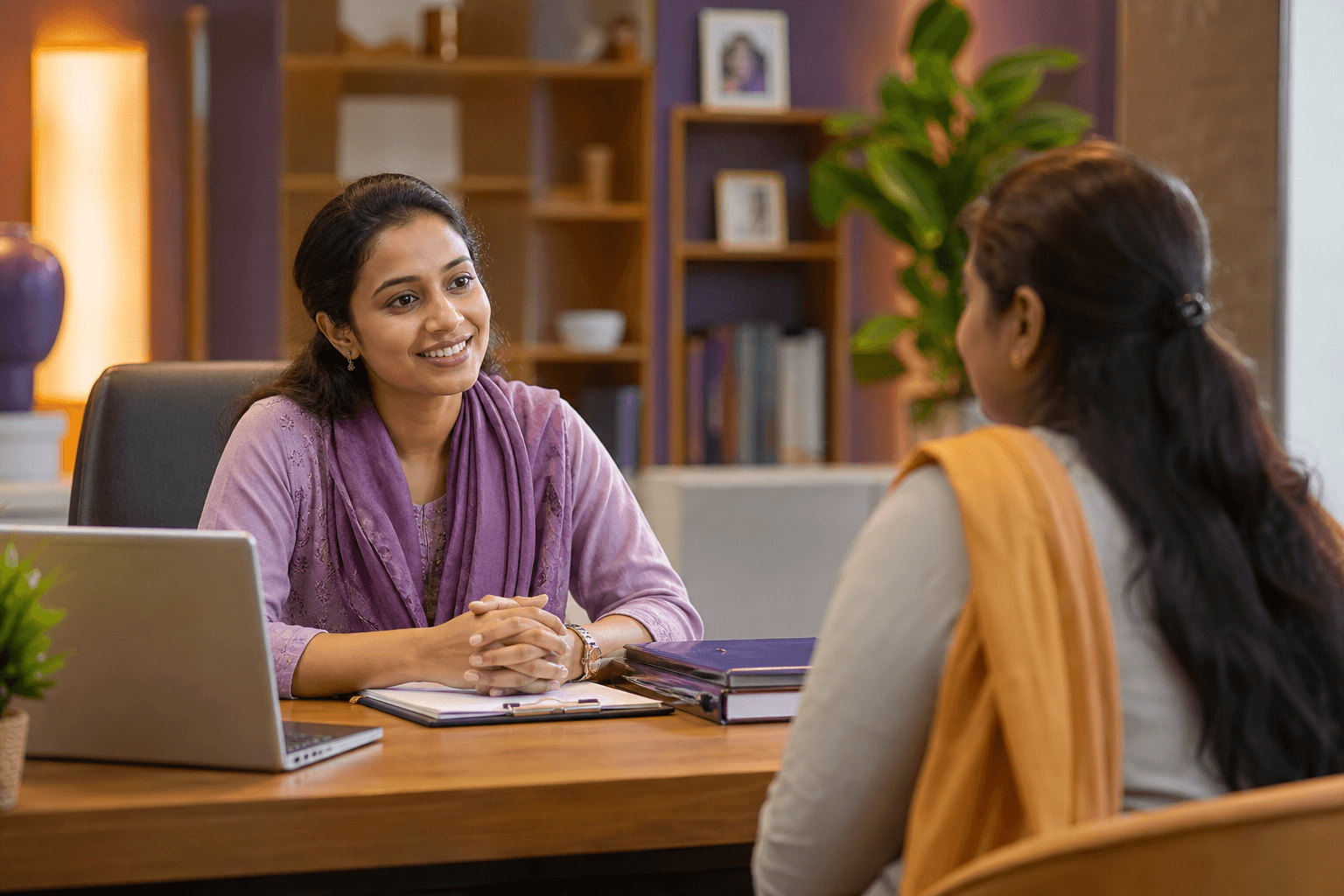 South Asian foundation volunteer speaking with a community member